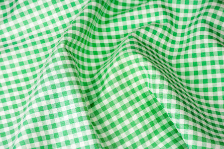 Green classic checkered table cloth fabric background texture.