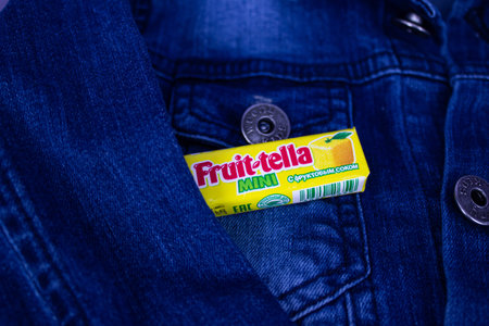 Kaliningrad, Russia, 17.02.2022: Blue denim jacket and Fruitella candies.