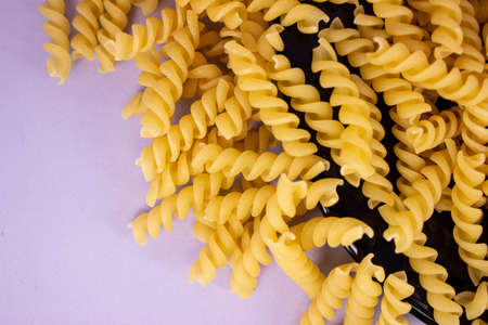 Dry pasta in the form of spirals close-up.の写真素材