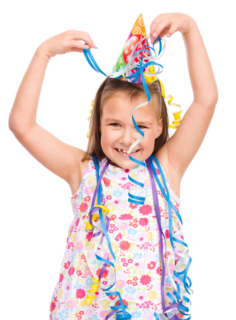 Cute beautiful girl celebrate her birthday, isolated over whiteの写真素材