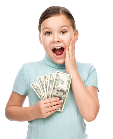 Cute girl with dollars, isolated over whiteの写真素材