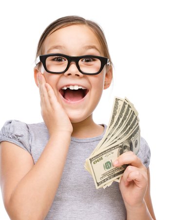 Cute girl with dollars, isolated over whiteの写真素材