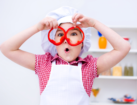 Cute girl make vegetable saladの写真素材