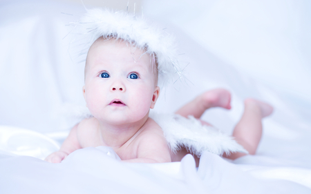 Adorable angel baby, close-up portraitの写真素材