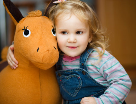 Little cute girl playing with toysの写真素材