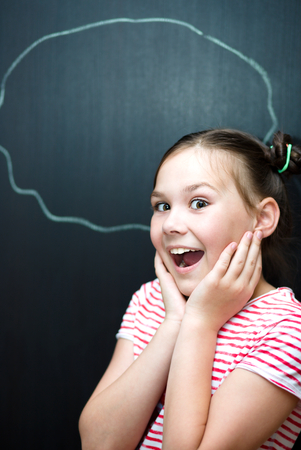 Portrait of cute girl. Success, creative and innovation concept. On black backgroundの写真素材