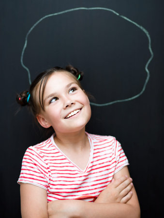 Portrait of cute girl. Success, creative and innovation concept. On black background