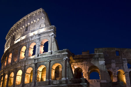 part of the famous amphitheater in Rome at nightの写真素材