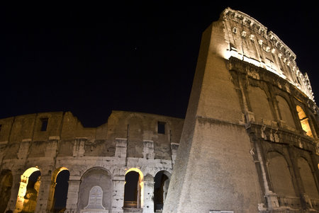 part of the famous coliseum in Rome at nightの写真素材