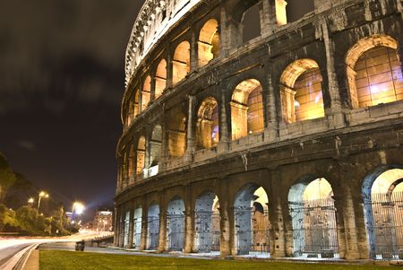 part of the famous coliseum in Rome at nightの写真素材