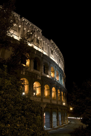part of the famous coliseum in Rome at nightの写真素材