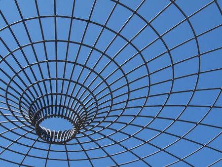 beautiful blue sky behind a metal frameworkの写真素材