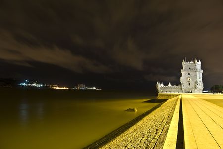 famous Torre de Belem illuminated at nightのeditorial素材