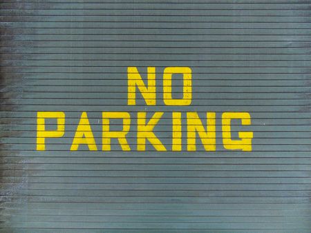No parking painted on a metallic garage doorの写真素材