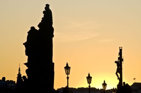 beautiful sunset at the Charles bridge in Pragueの写真素材