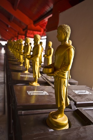 standing buddha statues on boxes for the collectの写真素材