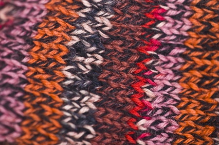 closeup of a knitted piece in colorful stripesの写真素材