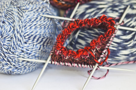 Woolen thread and knitting needle with shallow dof