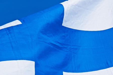 finnish flag fluttering in the wind on a sunny dayの写真素材