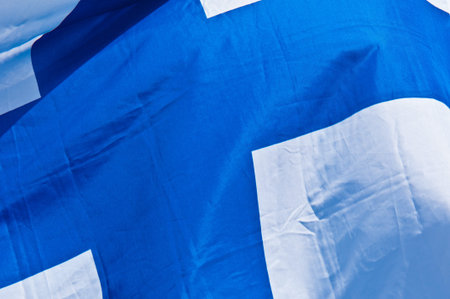 finnish flag fluttering in the wind on a sunny day