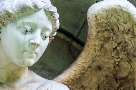 detail of a mourning sculpture on a cemeteryの写真素材