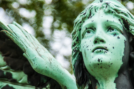 detail of a mourning sculpture on a cemeteryの写真素材