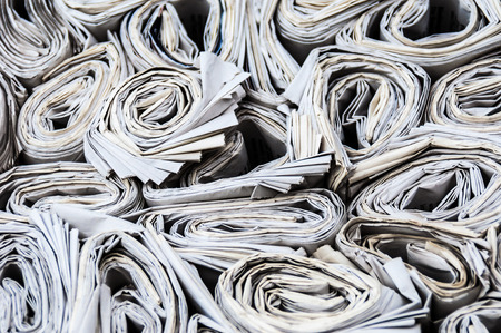 background of lots of rolls of newspapersの写真素材