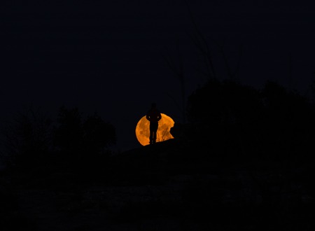 Amazing image with a model and the red moonの写真素材