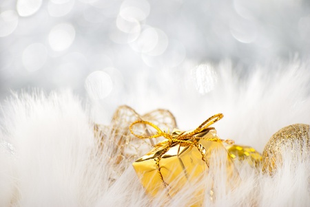 Golden christmas balls with present on abstract backgroundの写真素材