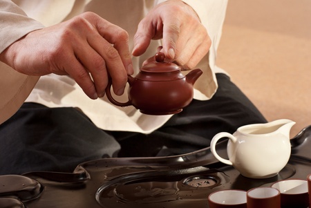 Chinese tea ceremony is perfomed by tea master in kimonoの写真素材