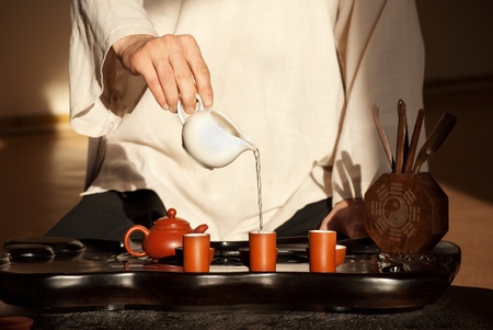 Chinese tea ceremony is perfomed by tea master in kimonoの写真素材