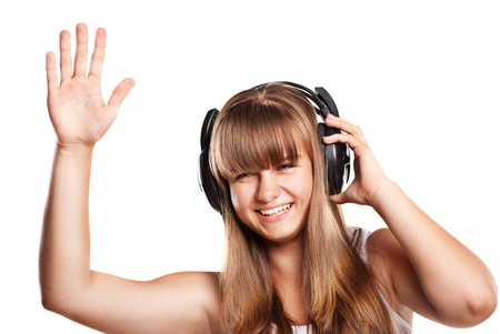 Lovely girl listening a music in headphones, white backgroundの写真素材