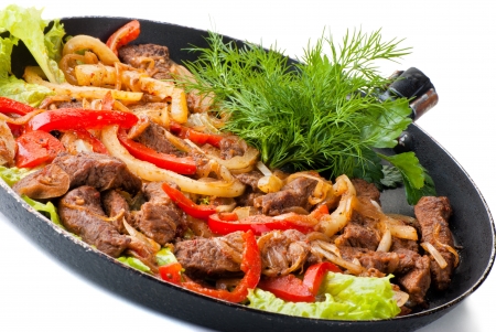 traditional mexican beef fajitas on white backgroundの写真素材