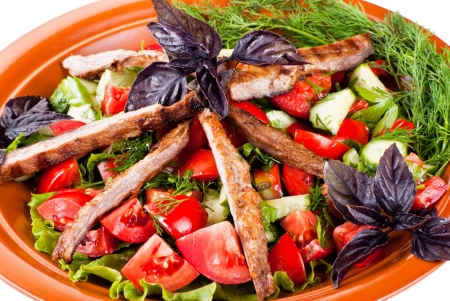 Strips of roast beef and sauteed vegetables. Salad. Isolatedの写真素材