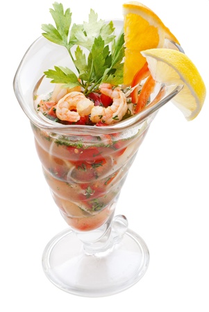 Large shrimp cocktail with lemon, pepper and onion isolated on white backgroundの写真素材