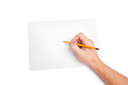 human hand with pencil writting something on whiteの写真素材