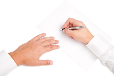 Business worker signing the contract to conclude a dealの写真素材