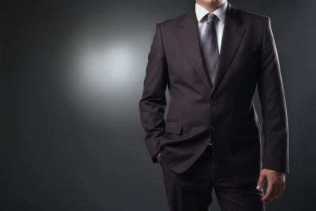 businessman in suit on gray backgroundの写真素材