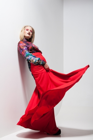 Fashion of young magnificent woman in red dress. の写真素材