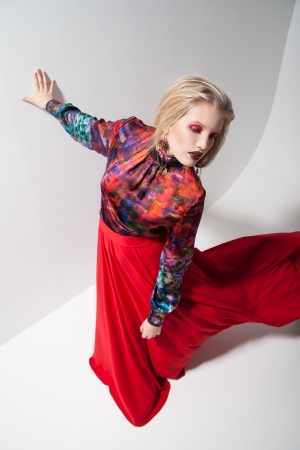 Fashion of young magnificent woman in red dress. の写真素材