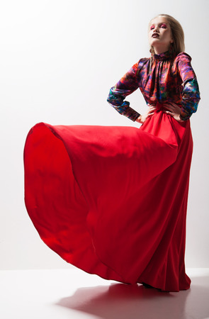 Fashion of young magnificent woman in red dress. の写真素材