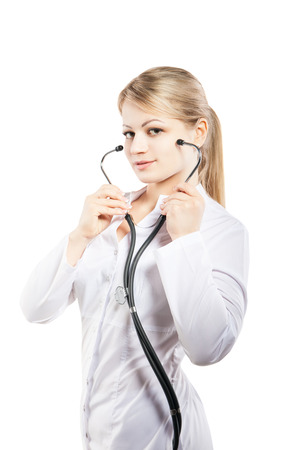 Smiling medical doctor woman with stethoscope. Isolated over white background.の写真素材