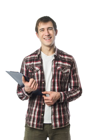 Stylish college student posing with notebook in hand on whiteの写真素材