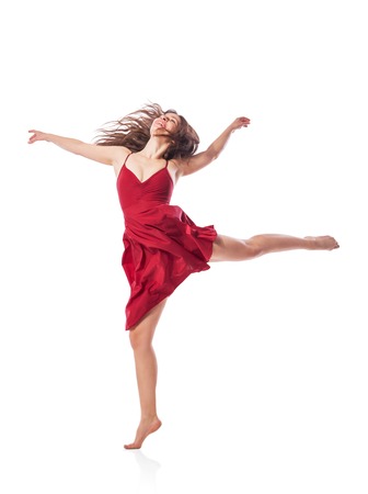Gorgeous young ballet dancer wearing red dress isolated over white backgroundの写真素材