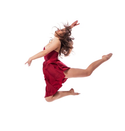 Gorgeous young ballet dancer wearing red dress isolated over white backgroundの写真素材