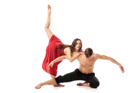 Couple of ballet dancers posing isolated over white backgroundの写真素材