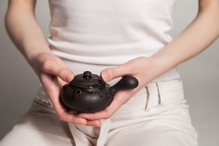 Chinese tea ceremony is perfomed by tea master in kimonoの写真素材