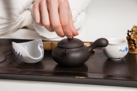 Chinese tea ceremony is perfomed by tea master in kimonoの写真素材