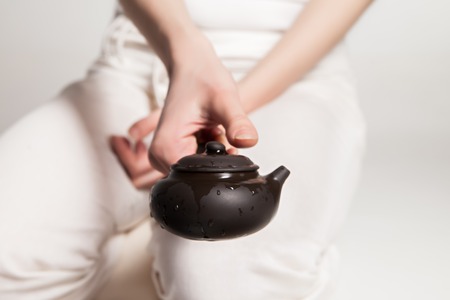 Chinese tea ceremony is perfomed by tea master in kimonoの写真素材
