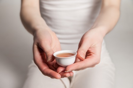Chinese tea ceremony is perfomed by tea master in kimonoの写真素材